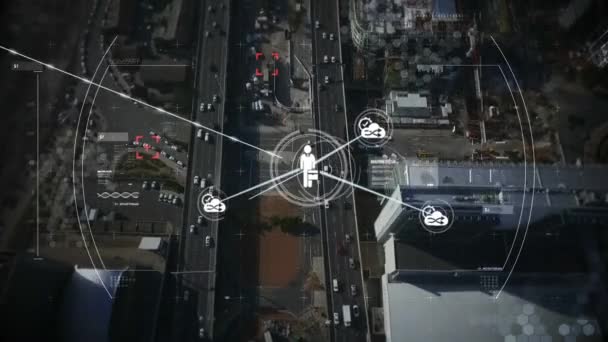 Animation d'un réseau de connexions et d'icônes se déplaçant sur une vue aérienne d'un paysage urbain en arrière-plan . 