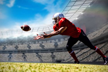 Amerikalı futbolcu bir stadyumun birleşik imajına karşı