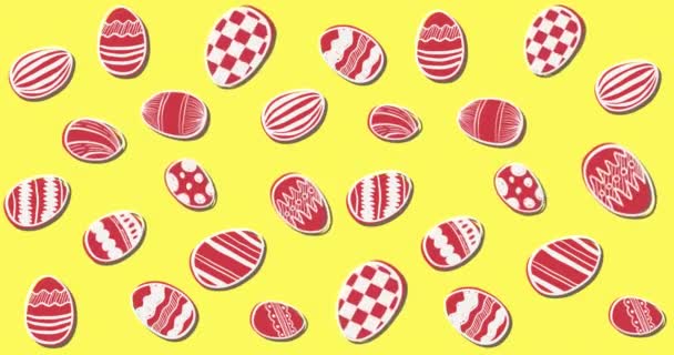 Animace několika řad vzorovaných bílých a červených velikonočních vajíček pohybujících se v bezešvé smyčce na žlutém pozadí. 4k