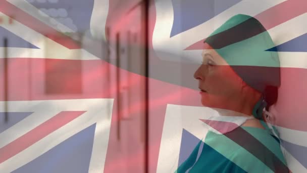 Animation British Flag Waving Female Doctor Wearing Protective Clothing Face — Stock Video