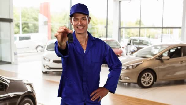 Animation Caucasian Mechanic Smiling Holding Out Car Keys Cars Showroom — Stock Video