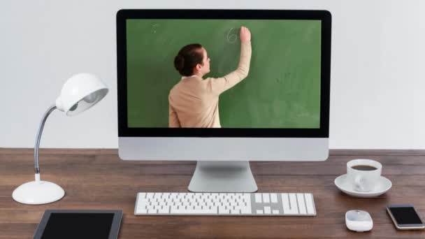 Animation Computer Monitor Showing Caucasian Female Teacher Writing Mathematics Equations — Stock Video