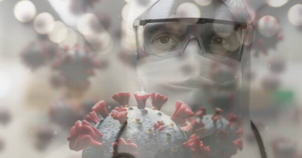 Digital illustration of macro Covid-19 cells floating over Caucasian doctor wearing protective clothes. Coronavirus Covid-19 pandemic concept digital composite