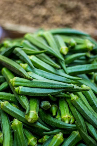 Green Ladies finger on the market - Okra, Abelmoschus esculentus, known in many countries as ladies\' fingers or ochro. The geographical origin of West African, Ethiopian & Asian origins