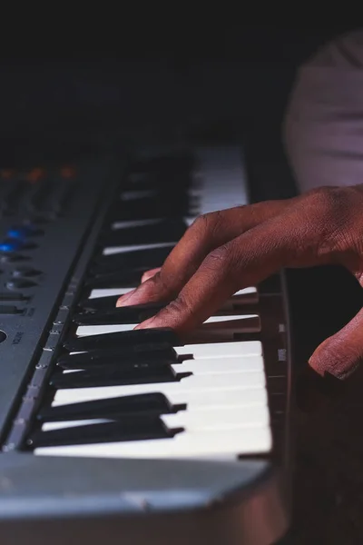Playing the Electronic Keyboard in Music Recording studio close up on hands. Playing electronic Piano.
