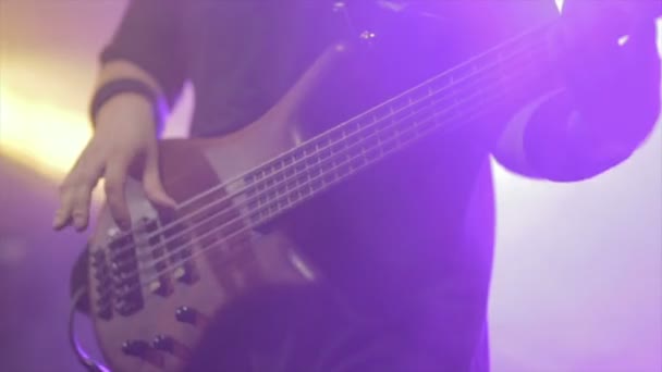 Man bass guitarist  playing electrical guitar on concert stage — Stock Video