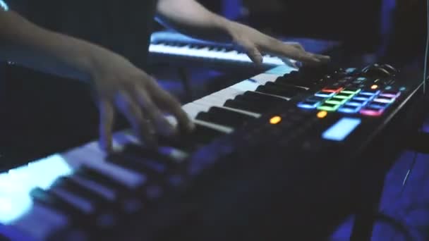 Musician playing on the keyboard synthesizer piano keys — Stock Video