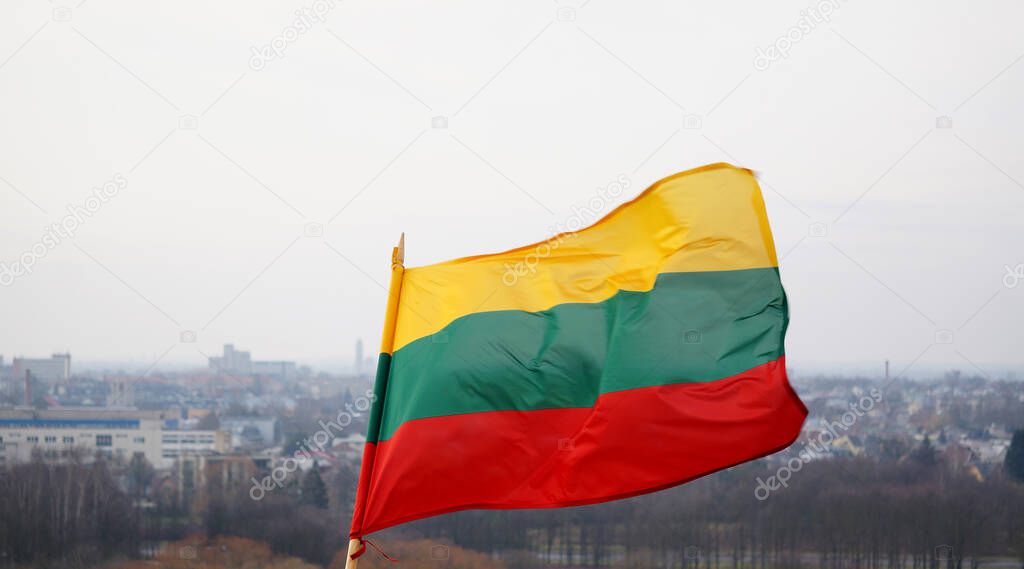 The Lithuanian flag is waving in tricolor over the city