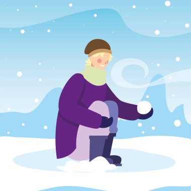 Kış giysileri içinde kar yağışı olan bir adam.