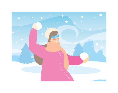 Kış kıyafetleri içinde kar yağışı olan bir kadın.