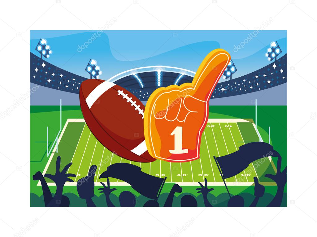 american football ball with hand glove on stadium grass