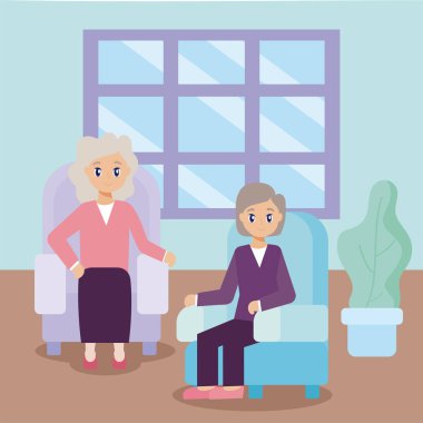 Bakım evi, oturma odasındaki yaşlı kadınlar.