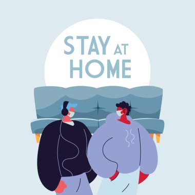 Evde yüz maskesi takan genç adamlar.