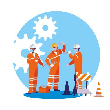 Yüz maskesi ile çalışan sanayi işçileri