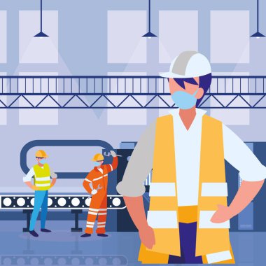 Yüz maskesi ile çalışan endüstriyel işçiler