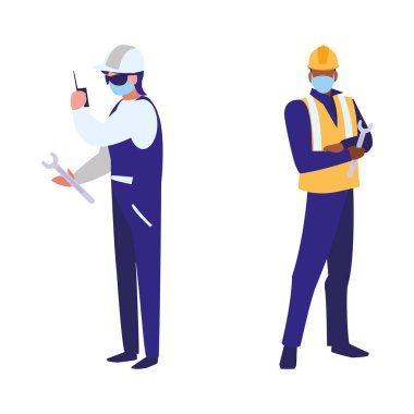 Yüz maskesi ile çalışan sanayi işçileri