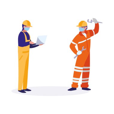 Yüz maskesi ile çalışan sanayi işçileri