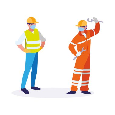 Yüz maskesi ile çalışan sanayi işçileri