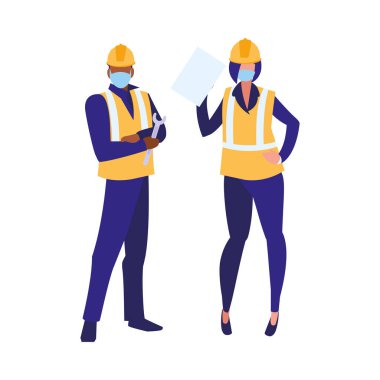 Yüz maskesi ile çalışan sanayi işçileri çifti