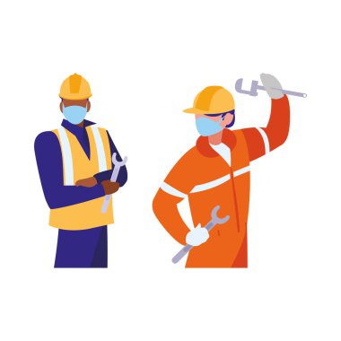 Yüz maskesi ile çalışan sanayi işçileri