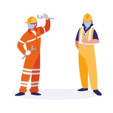 Yüz maskesi ile çalışan sanayi işçileri