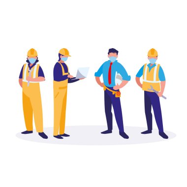 Yüz maskesi ile çalışan sanayi işçileri