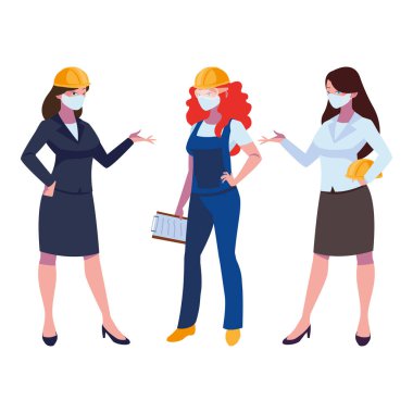 Yüz maskeleriyle çalışan kadın sanayi işçileri