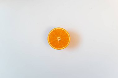 Isolated half orange in a white background. Flat lay, copy space, advertisement clipart