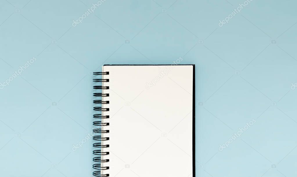 White blank notebook to plan future goals, challenges and achievements. Flay lay perspective with copy space