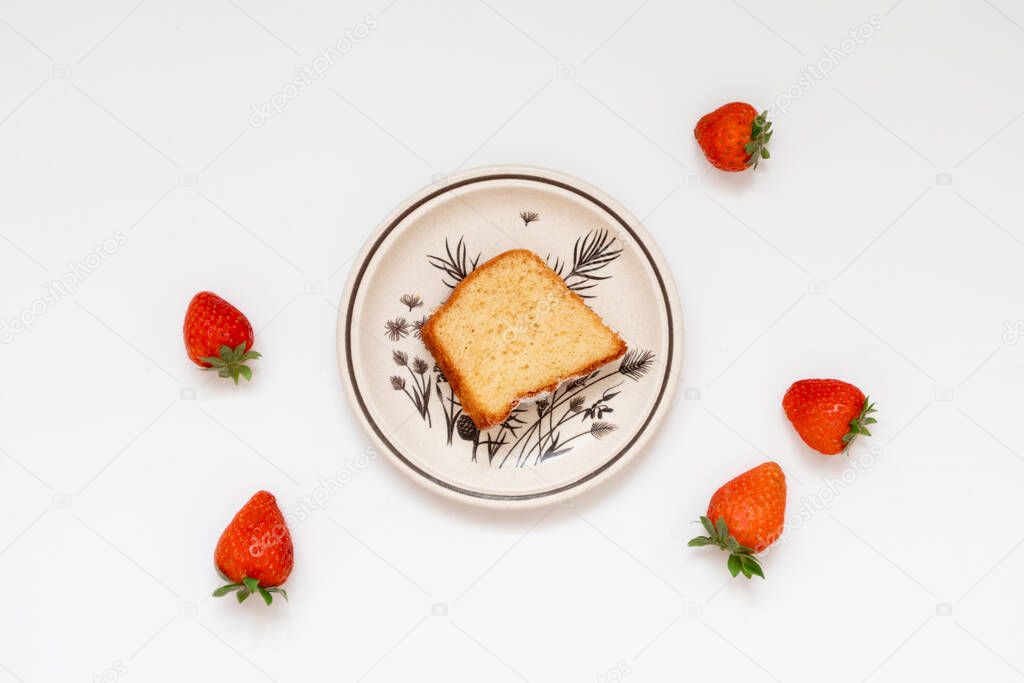 Handmade breakfast meal: culinary baked meal of cake and strawberries. Flat lay