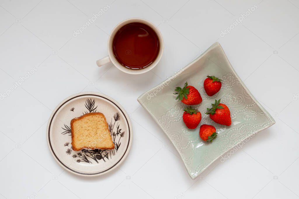 Homemade sweet breakfast: healthy strawberries with baked cake, flat lay