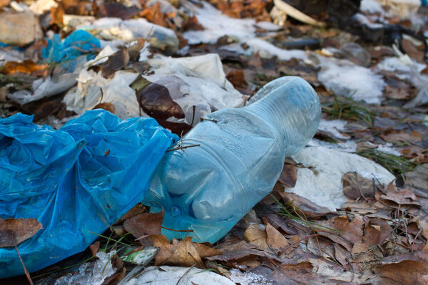 Pile of plastic bags and other refined petroleum products dumped in landfill. Garbage heap gives infiltrate into ground. Waste sorting is required. Lviv city