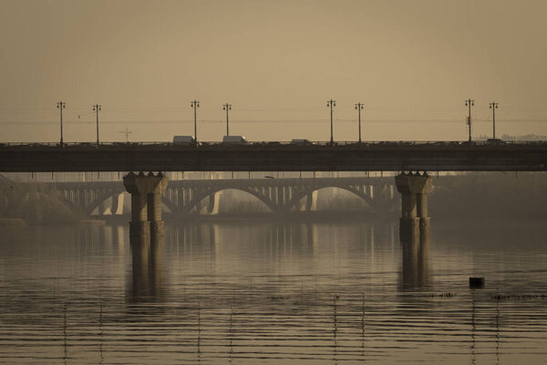 Art photo of famous Paton Bridge, one of the bridges across the Dnieper in Kiev, Ukraine. Art sepia.