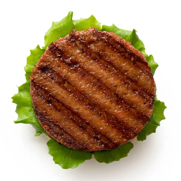 Freshly grilled plant based burger patty on bun with lettuce iso — Stock Photo, Image