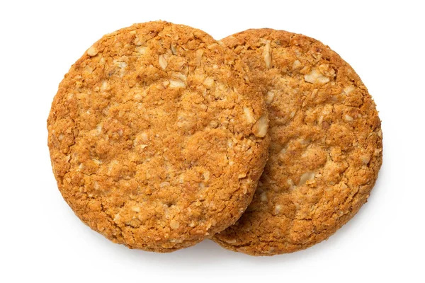 Two crunchy oat and wholemeal biscuits isolated on white. Top vi — Stock Photo, Image