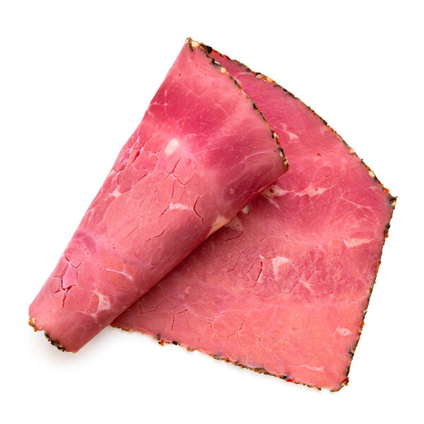 A single rolled slice of pastrami isolated on white. Top view.