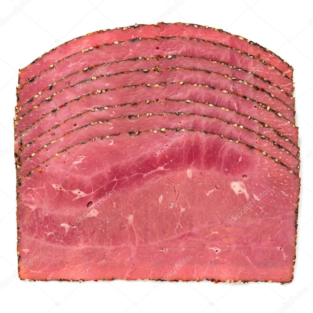 Arranged slices of pastrami isolated on white. Top view.
