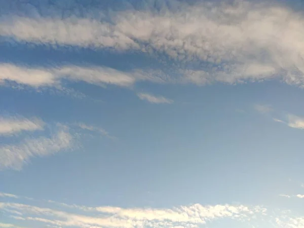 Clear blue sky with small white clouds as background, panoramic view of sky — Stock Photo, Image