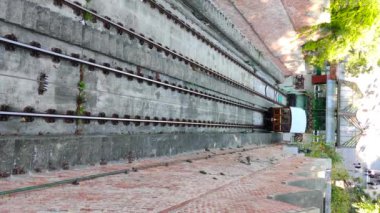 An old cable car rises up the rails. Vertical video