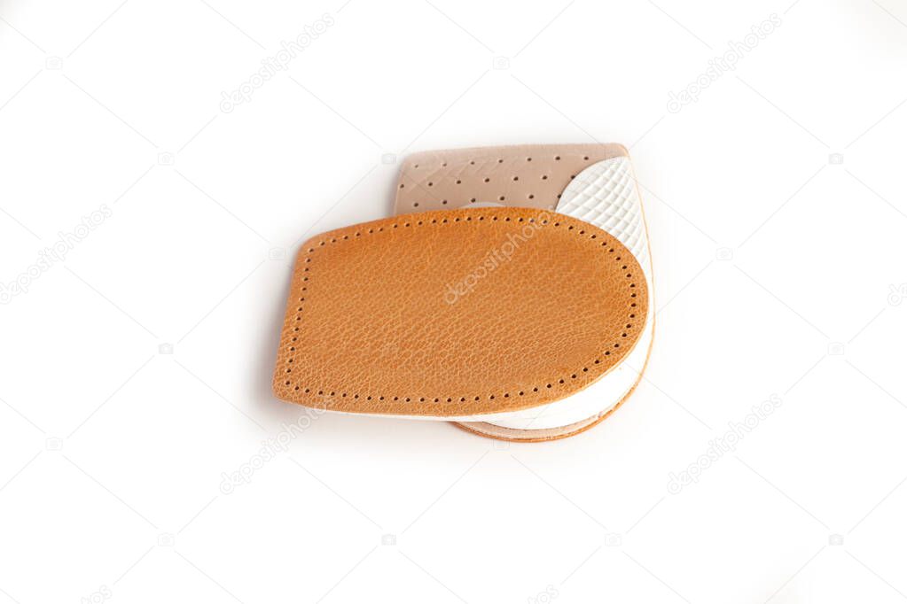 Orthopedic silicone heel from corns for the correction of different lengths of legs isolated on white background