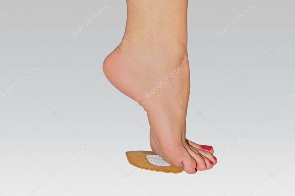 Orthopedic silicone heel from corns for the correction of different lengths of legs isolated on white background. Silicone insert for the forefoot. Silicone thumb protector with interdigital septum