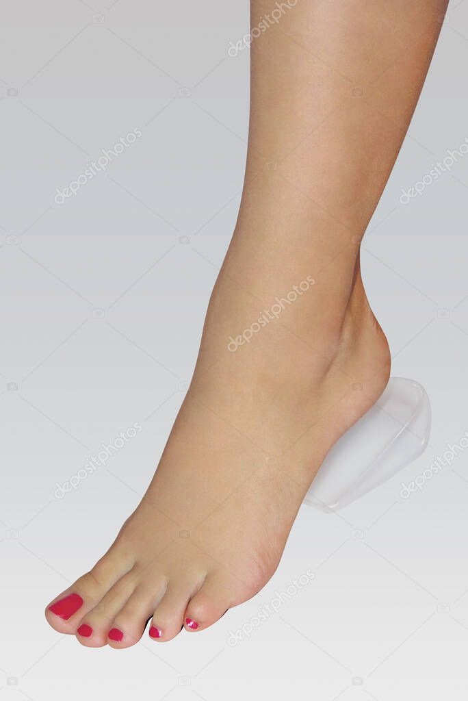 Orthopedic silicone heel from corns for the correction of different lengths of legs isolated on white background. Silicone insert for the forefoot. Silicone thumb protector with interdigital septum