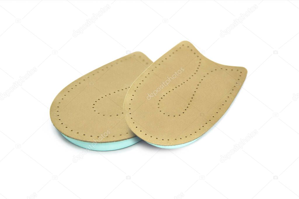 Orthopedic leather heel pad from corns for the correction of different lengths of legs isolated on white background. leather insert for the forefoot. Medical insoles. Flat Feet Correction.