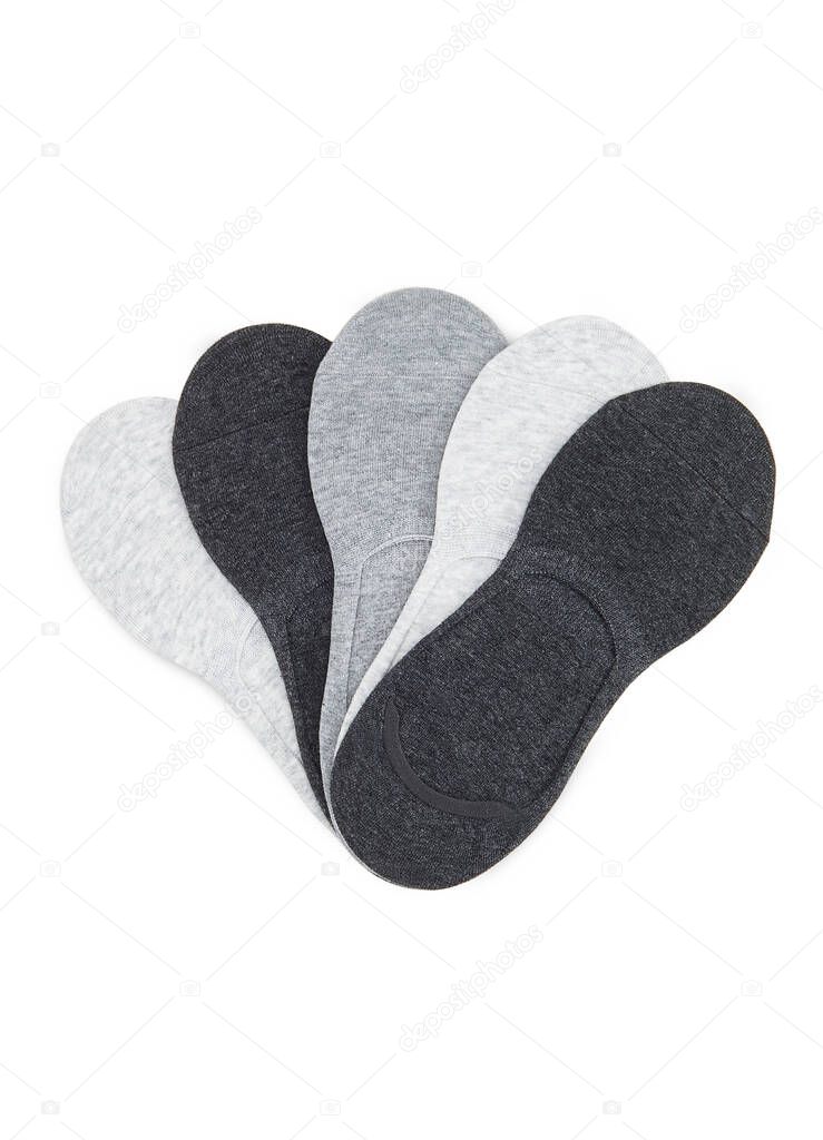 Set of short socks white, grey, black isolated on white background. Three pair of socks in different colors. Sock for sports on invisible foot as mock up for advertising, branding, design.