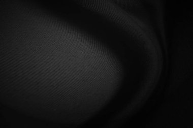 Siyah kumaş çarşaflar arka plan veya doku, dalgalarla soyut, yumuşak odaklı kumaş ipeği siyah