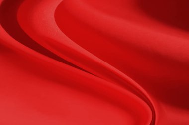 Kırmızı kumaş çarşaflar arka plan veya doku, dalgalarla soyut, yumuşak odak bezi ipeği kırmızı