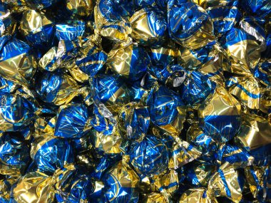 Parlak ve parlak paketlemedeki soyut arkaplan şekerleri