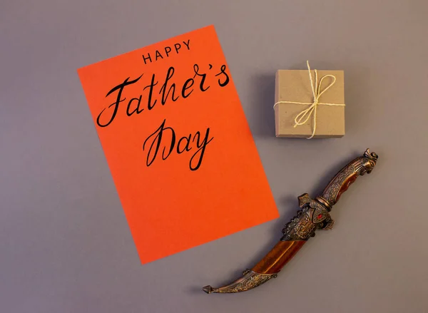 holiday greeting card for father's day with text on a gray background, brutal