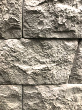 Arka plan, eski gri-kahverengi taş renginin dokusu. Duvarlar için kullanılır.