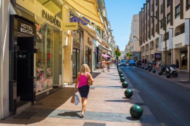 Rue d Antibes in Cannes, South France clipart